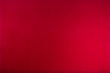 Red color velvet texture background. Top view.