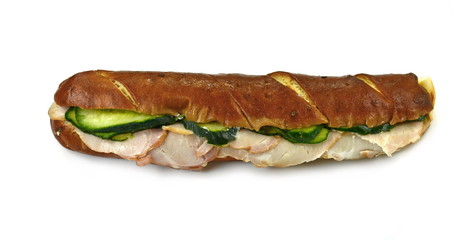 Delicious sandwich with meat and fresh vegetables isolated on white background. Fresh baguette. Classic BLT sandwiches. Close up.