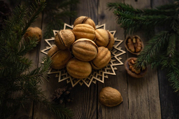 Nuts for tea on a wooden table. Winter