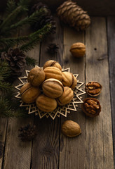 Nuts for tea on a wooden table. Winter