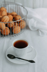 Nuts for tea with condensed milk on a wooden table.