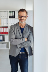 Relaxed stylish businessman smiling at camera