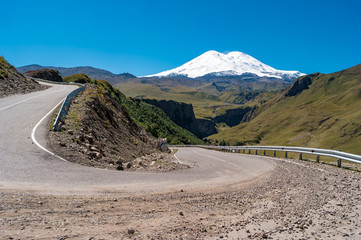 Kabardino-Balkaria, Russia. Mountain hairpin turn with view of mount Elbrus.