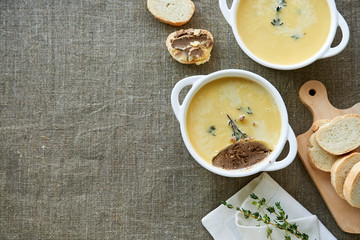Chicken liver pate with thyme in a white bowl