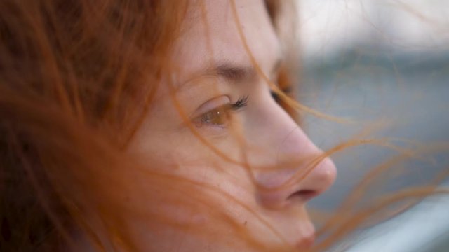 Portrait of Beautiful Young Redhead Smiling Woman Exploring Spirituality Contemplating Future with Wind Blowing Hair Сlose up