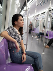 Woman are waiting sky train at station