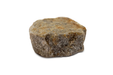 Conglomerate rock isolated on white background. Conglomerate is a clastic sedimentary rock that contains large  rounded clasts. There is noise and grain caused by the texture of the stone.
