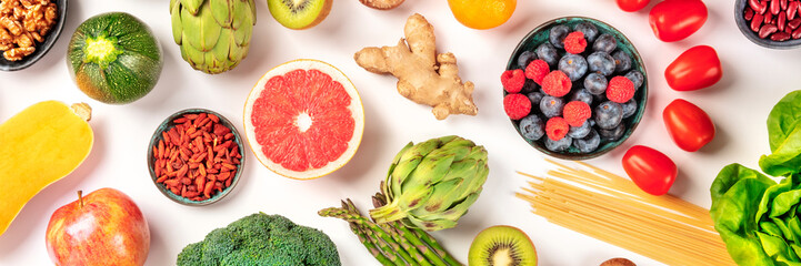 Vegan food panoramic flatlay shot. Healthy diet concept. Fruits, vegetables, pasta, nuts, legumes...