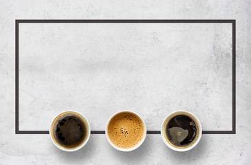 paper cups of coffee on cement table background. top view