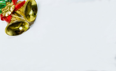 Golden bells with red ribbon for Christmas background