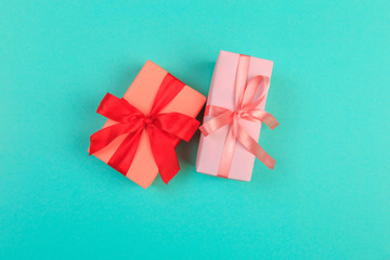 Gift box with ribbon and bow on color background and space for text. Top view - Image