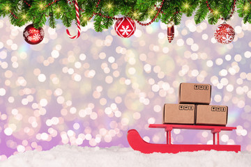 Christmas decoration 2020, a deer carries Christmas gifts on a sled, the concept of delivery and logistic