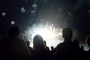 Fototapeta premium Crowd watching fireworks and celebrating new year