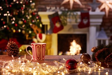 Christmas still life with mug and fireplace