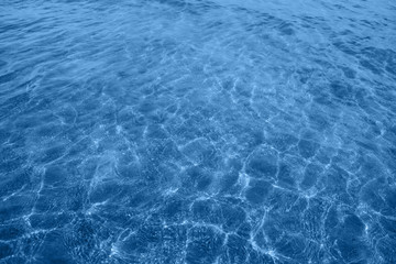 Background for your projects. Classic blue sea water. Color of the year 2020. Trend of the year.