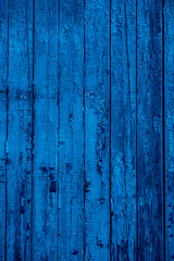 Fototapeta na wymiar Old rustic wall with cracked blue paint