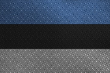 Estonia flag depicted in paint colors on old brushed metal plate or wall closeup. Textured banner...