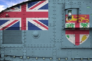 Fiji flag depicted on side part of military armored tank closeup. Army forces conceptual background
