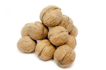 Walnut pyramid closeup on a white background. Isolated