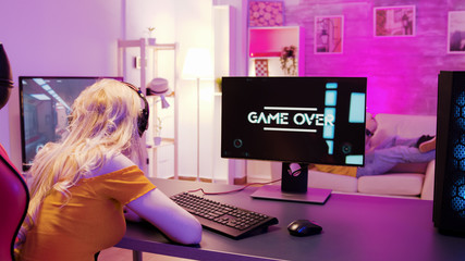 Sad blonde because she lost on a shooter game © DC Studio