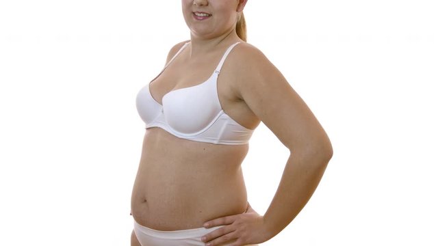 Gorgeous Plus Size Woman Strike A Pose For The Camera Happily Wearing Her White Lingerie - Close Up Shot
