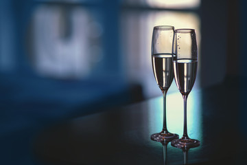 A pair of glasses of champagne in the interior. New Year and others holiday concept.