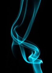 Abstract of blue green coloured smoke