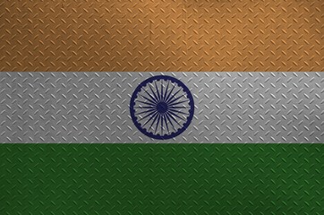 India flag depicted in paint colors on old brushed metal plate or wall closeup. Textured banner on rough background