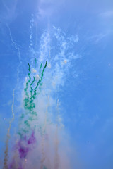 Colorful smoke in the blue sky background