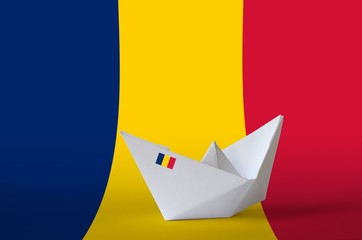 Chad flag depicted on paper origami ship closeup. Handmade arts concept