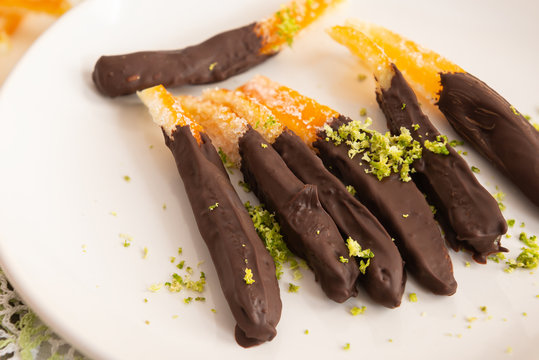 Candied orange peel in chocolate or sugar is a favorite Christmas treat for children and adults