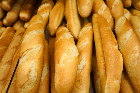 fresh baked baguettes in bakery. Assortment of baked bread
