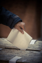 Person voting, casting a ballot