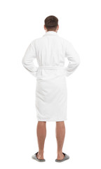 Fototapeta premium Man wearing bathrobe on white background, back view
