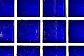 Dark blue glass bricks background. Dark blue glass bricks texture.