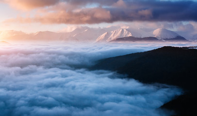 Naklejka na ściany i meble Perfect morning moment in alpine foggy valley.