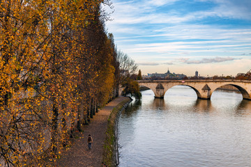 Autumn day in Paris  by Seine river , France.