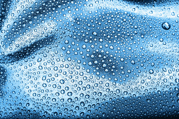Drops of water on blue background.