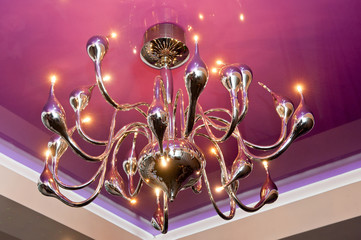 Gold metal chandelier with a large number of light bulbs