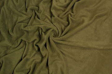 Fabric fleece green top view. Texture of textile fleece bedspread.