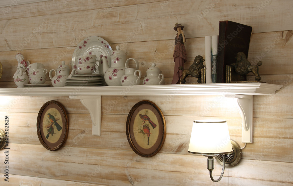 Wall mural The interior wall of the dining room with lamps, a shelf and utensils