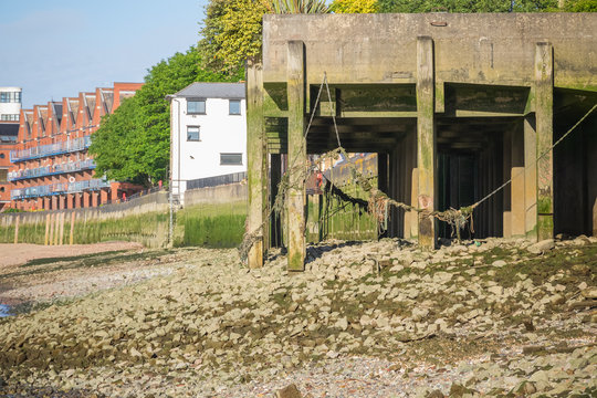 Wooden jetty on the foreshore of river Thames in London