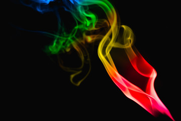 multicolored smoke photo aginst balck background