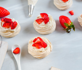 small strawberry pavlova meringue cakes pattern with cream top view