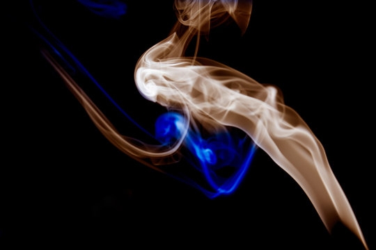 multicolored smoke photo aginst balck background