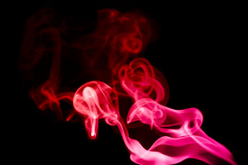 multicolored smoke photo aginst balck background