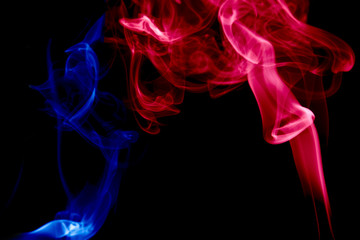 Obraz premium multicolored smoke photo aginst balck background