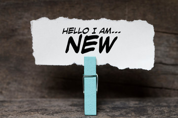 I am new written on a torn paper