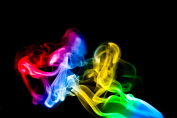 Obraz premium multicolored smoke photo aginst balck background