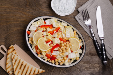 Raw vegetables and chickpeas salad